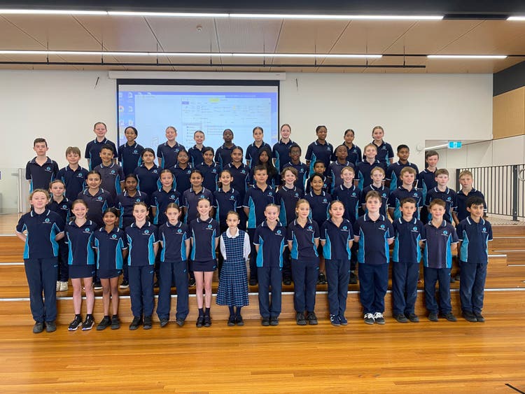 Students in hall for a presentation